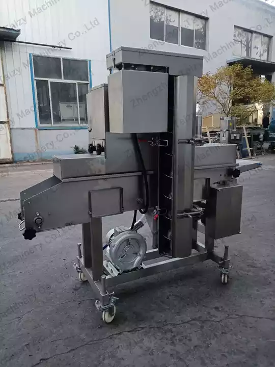 Breadcrumb coating machine for meat patty